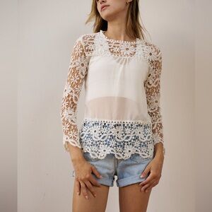 Sheer white blouse with lace details